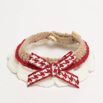 Handmade brown crochet cat collar made from soft yarn, featuring a decorative ribbon