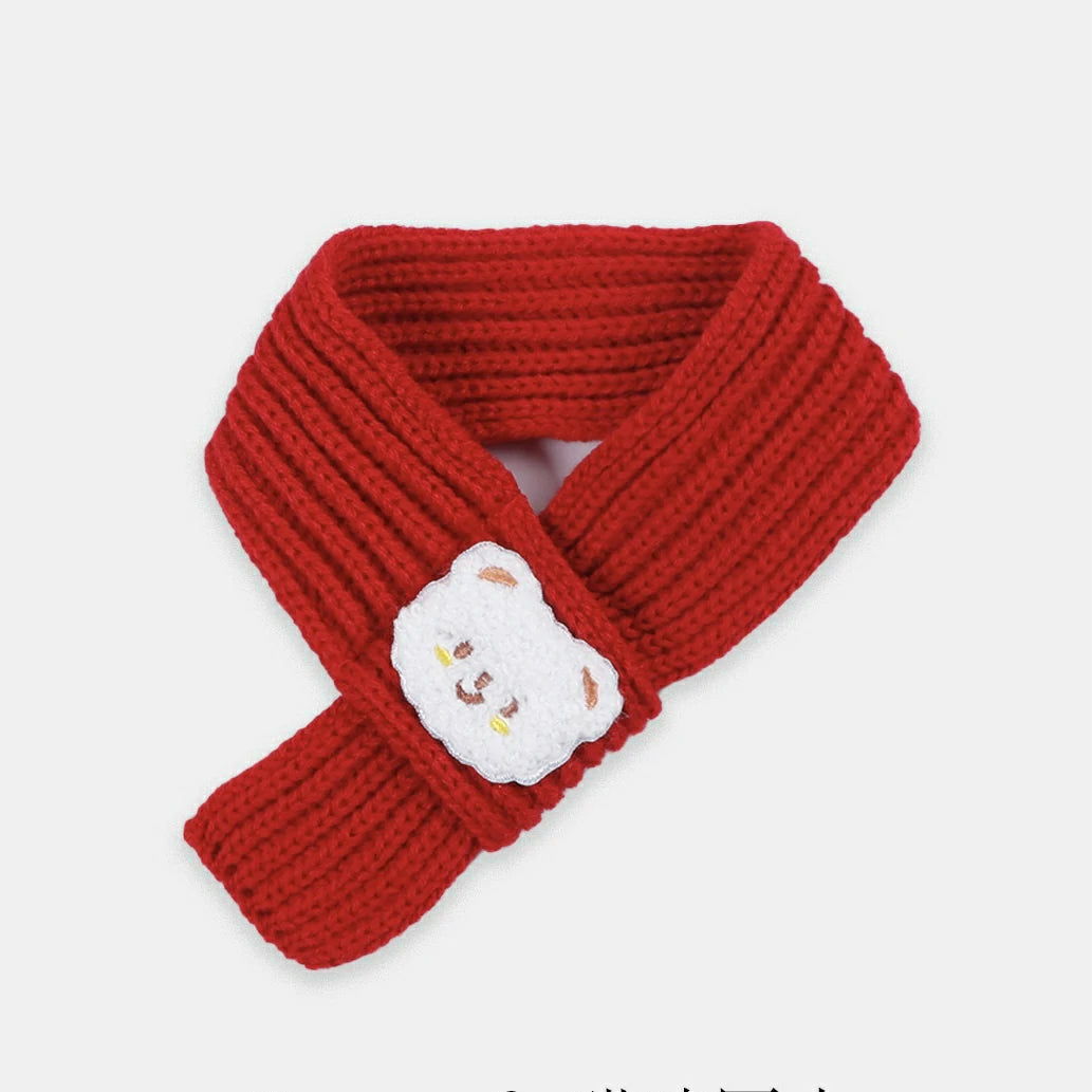 Handmade knitted red scarf for cats, featuring a bear charm. Made from soft fabric, it provides warmth during winter months.