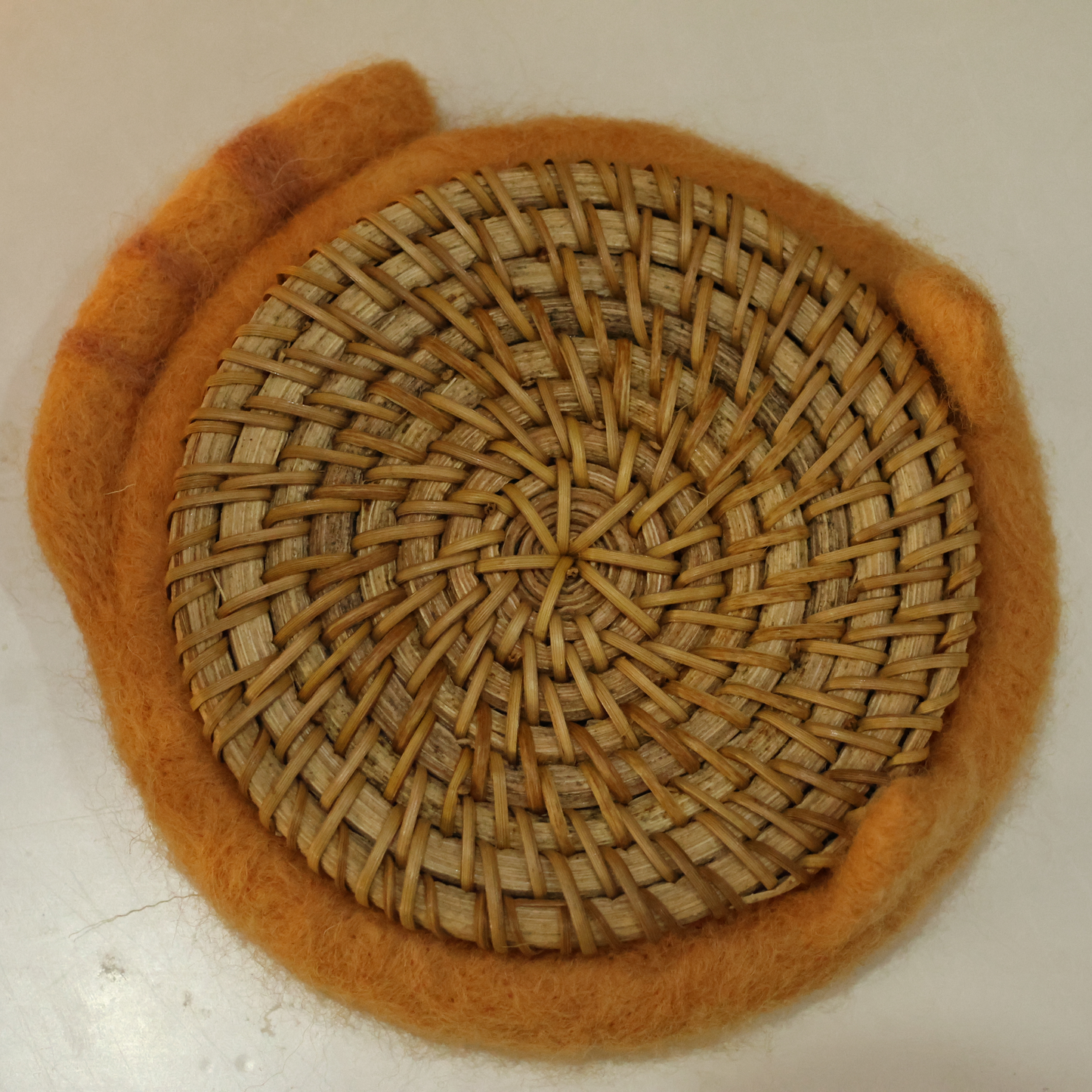 cat-themed coaster combines a carefully crafted wool felt base with an added bamboo layer