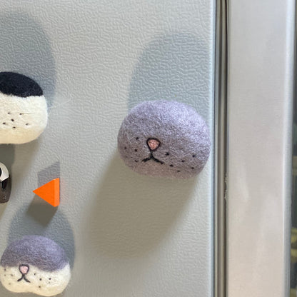 Cat whisker collector magnet made from wool felt, perfect for preserving your cat’s fallen whiskers as a keepsake on your fridge.