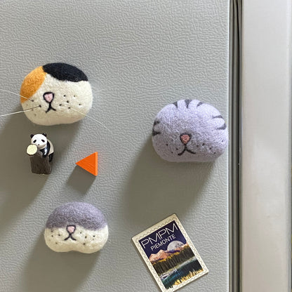 Cat whisker collector magnet made from wool felt, perfect for preserving your cat’s fallen whiskers as a keepsake on your fridge.